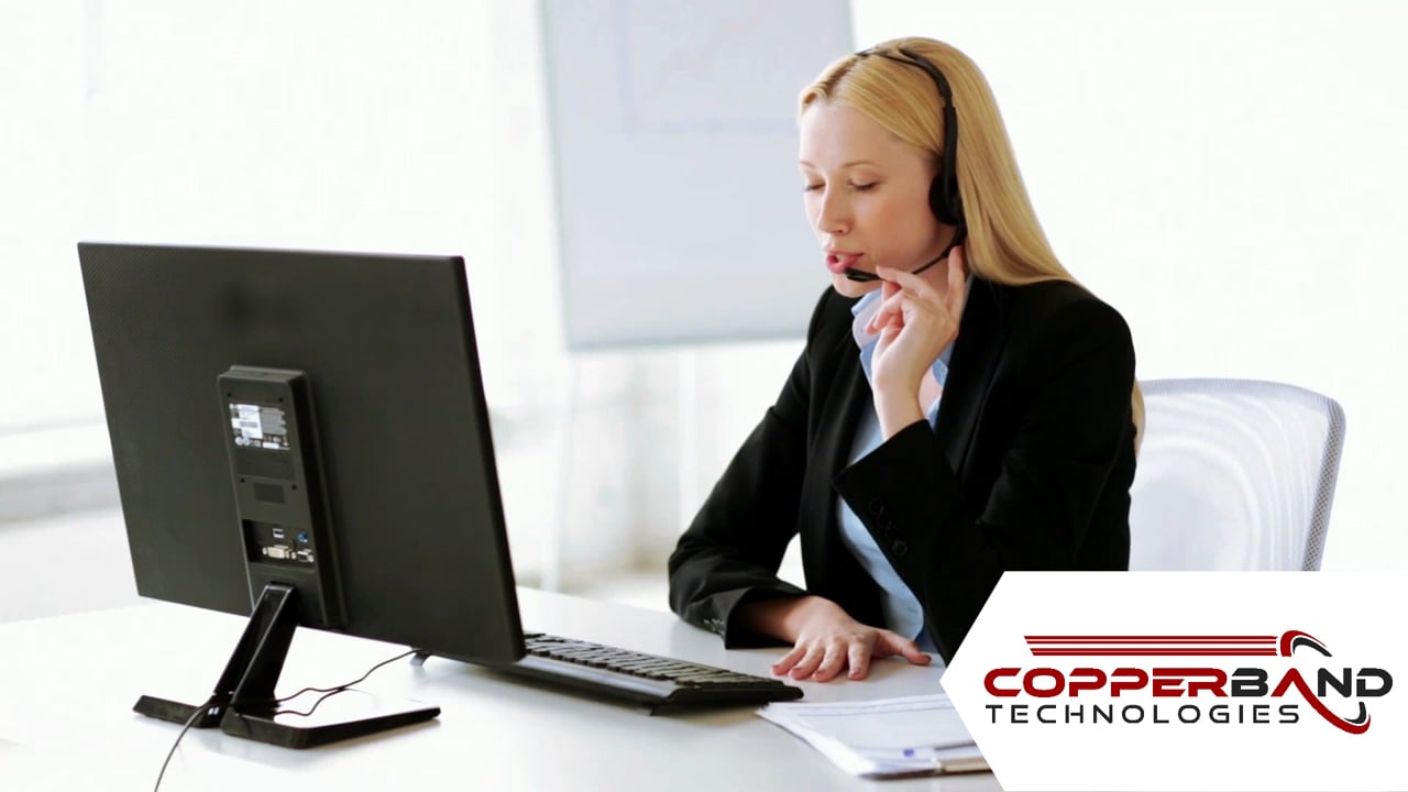 Woman with Headset at a computer