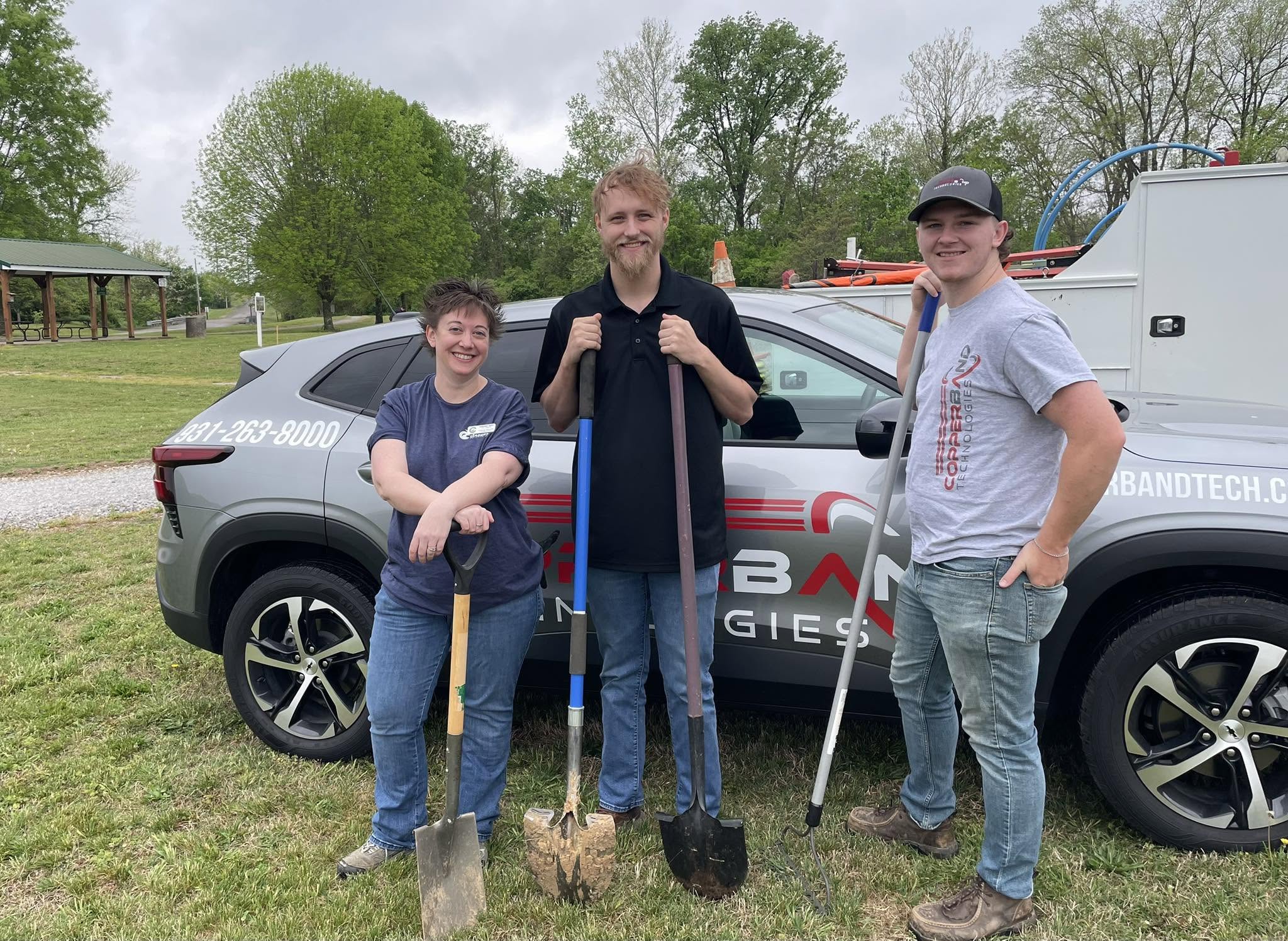 Copperband team members with shovels at a Jeffers Bend cleanup day