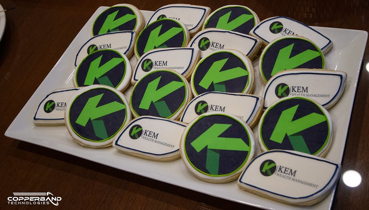 Sugar cookies iced with the Kem Wealth Management logo at the February 2026 Quality Service Award presentation