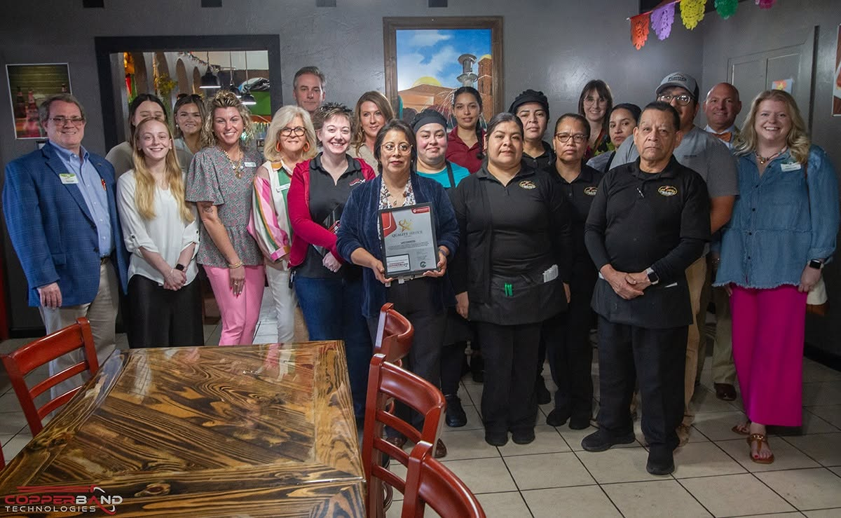 Chamber members and the Las Fuentes staff with the April 2026 Quality Service Award certificate