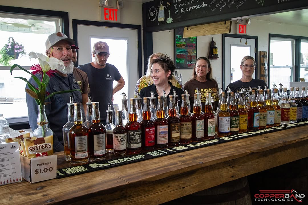 The MB Roland Distillery team behind the tasting room bar
